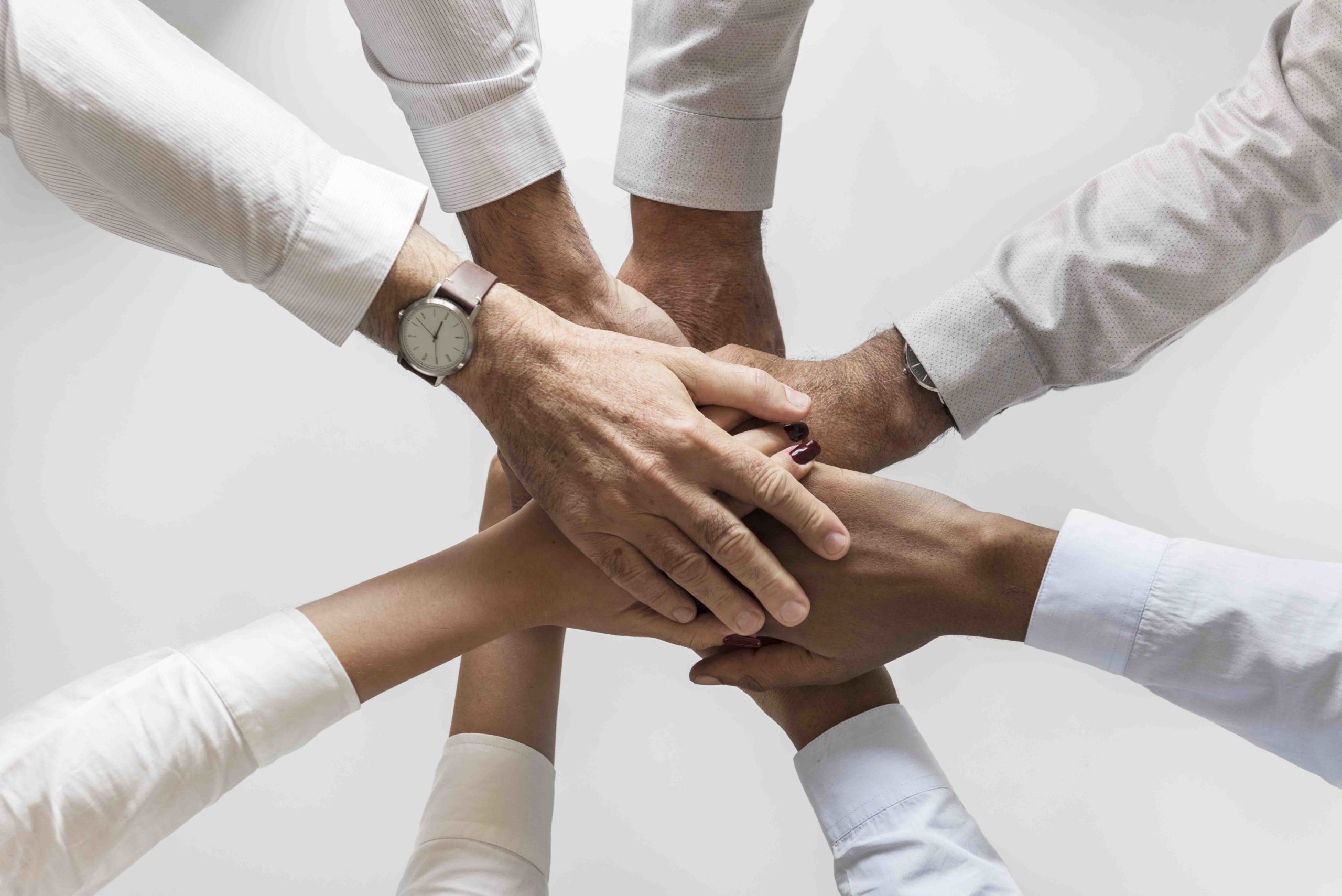 business hands joined together teamwork